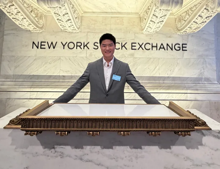 Standing at the podium at the New York Stock Exchange